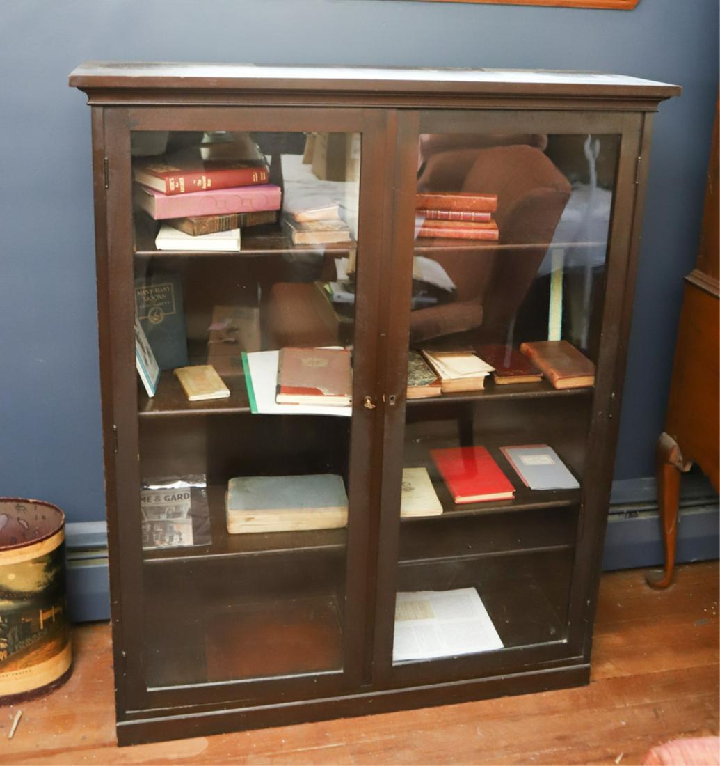 MAHOGANY (2) DOOR GLAZED BOOKCASE: Divided center with (8) adjustable shelves. 51 x 42 x 13 inches.