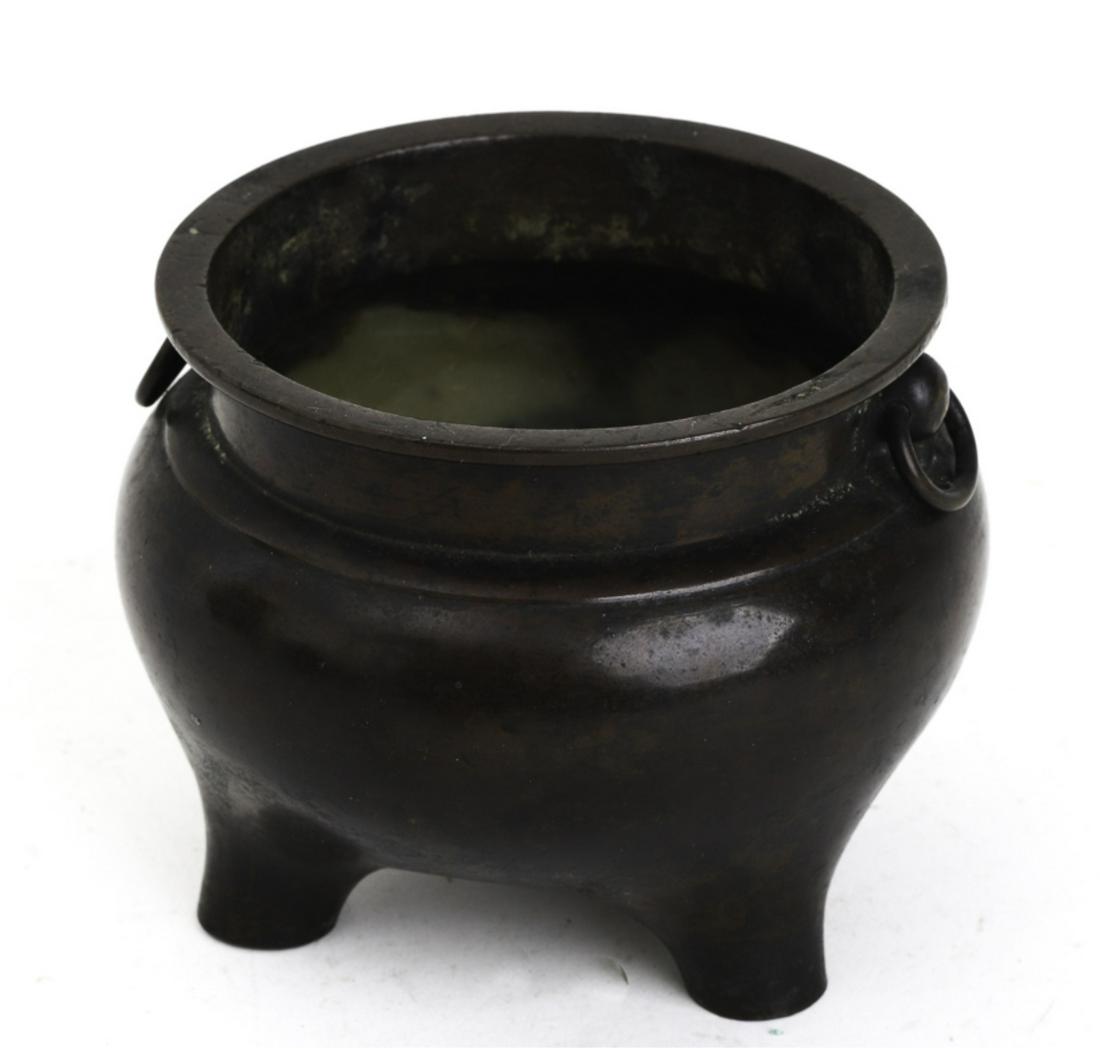 (1368-1646) MING DYNASTY CHINESE BRONZE CENSER: Incense burner with tripod feet and ringed handles. 3 3/4 x 4 1/2 inches. Together with an early sale receipt from Bullock's of Los Angeles which opened in 1907