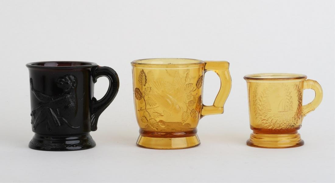 (3) AMBER AND AMETHYST EAPG MUGS: Including: Sailboat and lighthouse, songbirds and monkeys3 3/4 inches (and under)
