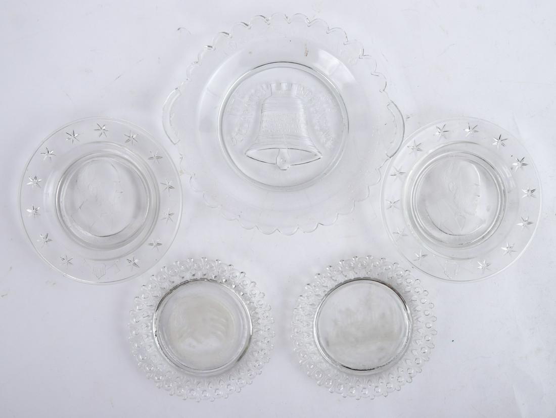 (5) EARLY AMERICAN PRESS GLASS PATRIOTIC PLATES: Including: Liberty Bell, Battleship Maine, (2) James Garfield and Admiral Dewey. 8 1/2 inches (and under)