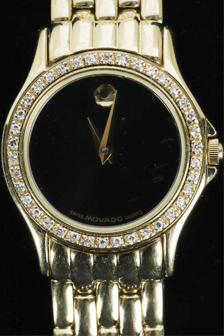 MOVADO LADY'S WATCH with 14k GOLD & DIAMOND BEZEL: Gold plated stainless steel band. water resistant serial #907673. approx 7 inches