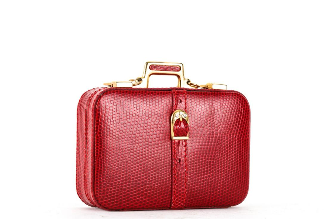 ITALIAN LEATHER SUITCASE-FORM LIPSTICK CASE: Case hinges open to mirror. 3 3/4 x 4 1/4 x 1 1/2 inches