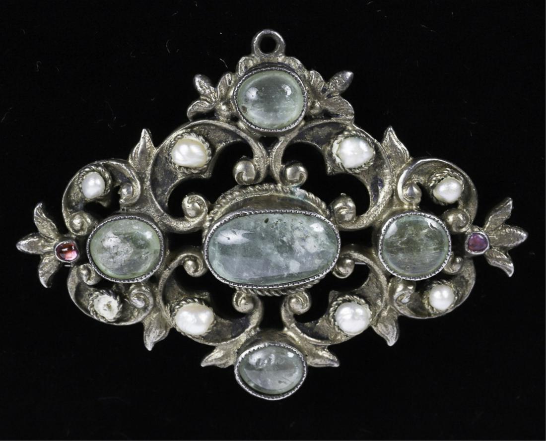 ANTIQUE SILVER AUSTRO HUNGARIAN BROOCH/PENDANT: Green beryl (emeralds), ruby and pearls. One pearl absent. Unsigned. Tests as sterling silver