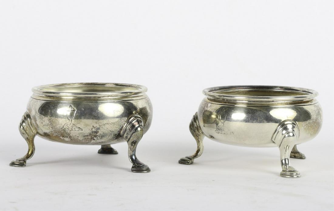 PAIR OF BRITISH STERLING SILVER MASTER SALTS 1751: Each engraved with a flaming chalice on a rocky pate. maker signed D.A. ? 2 x 3 inches 7.49 troy ounces