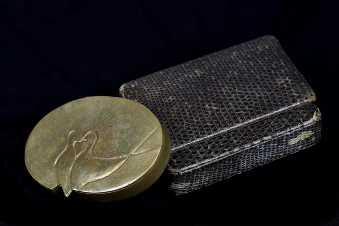 LINE VAUTRIN (1913-1997): (2) Doves hand hammered on shaped lid and conforming case. Opens to gold washed interior and mirror. signed. In its original snakeskin box. Vautrin, a highly respected 20th century French artist chris