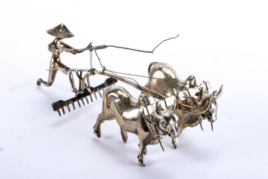 VICE PRESIDENT OF INDONESIA PRESENTATION PIECE: Silver miniature of a farmer driving an ox plow. marked 800. Presented by HANNENGKU BUWOND, Vice President of the Republic of Indonesia. 4 1/2 x 9 x 4 3/4 inches (presentation box). 3.6 troy ounces.