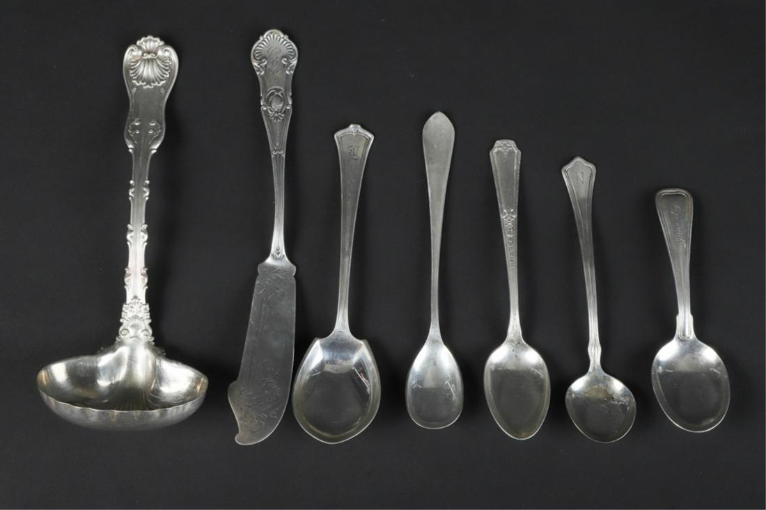 GROUPING OF (7) STERLING SILVER SPOONS & FLATWARE: Including a sauce ladle by Whiting and an offset butter spreader by Gorham. 7 3/4 inches (and under). 6.64 troy ounces