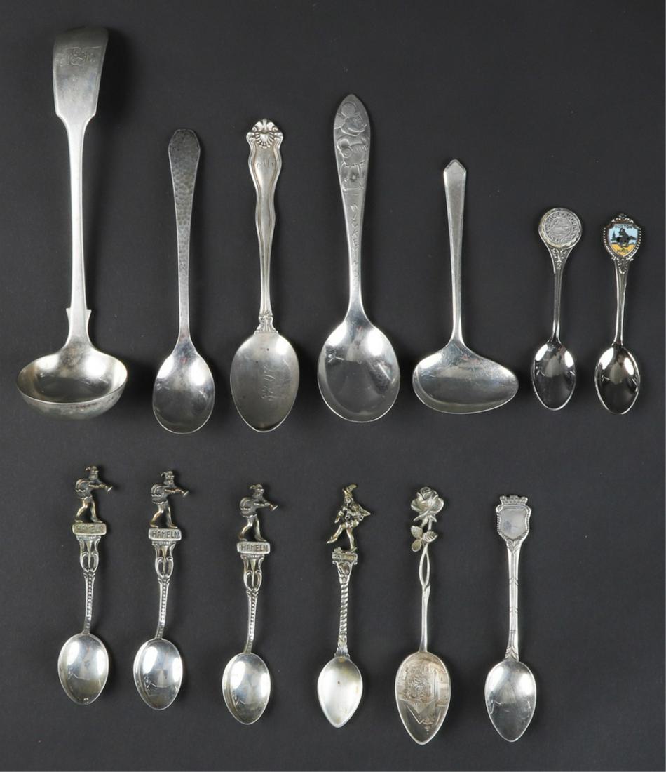 (6) GERMAN SILVER SOUVENIER DEMITASSE SPOONS: Including Hameln .800 and higher. 2.1 troy ounces. Together with a grouping of silver plate, Mickey Mouse and souvenir spoons