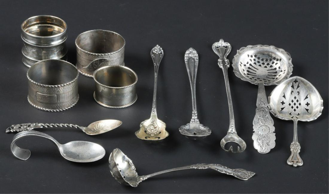 GROUPING OF SILVER and COIN SILVER TABLEWARES: Including: Whiting "Lily of the Valley" demitasse spoon, (3) olive spoons, juvenile, (4) napkin rings and (3) ladles. 7.3 troy ounces