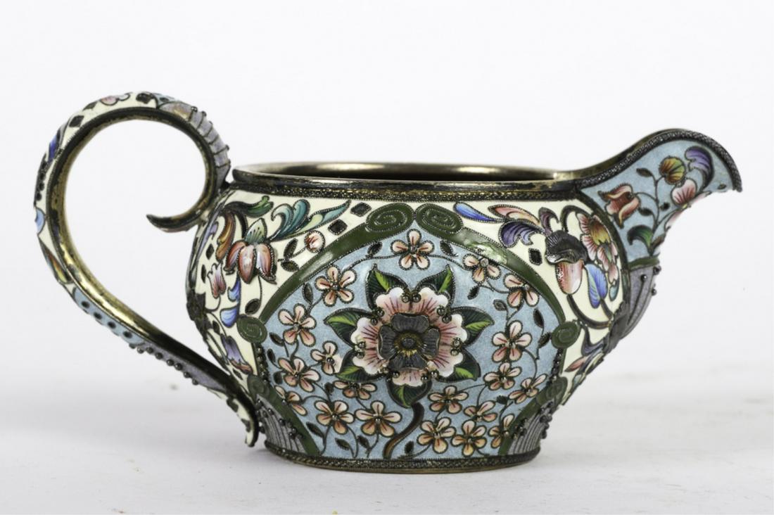 MIKHAIL F. SOKOLOV ENAMELED SILVER CREAMER: Moscow 1860-1890. Cloisonne- enameled 84 silver. Handle, font and spout decorated brightly with a great variety of enameled and applied flowers. signed. 2 3/8 x 4 3/4 inches. 4.35 troy ounces
