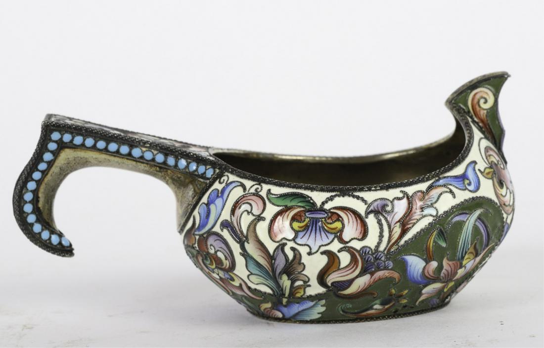 RUSSIAN ENAMELED SILVER KOVSH SIGNED M.G.: Stylized flowers and beaded handle on a white and green enameled ground. Outlined with silver beads and roping. signed. 1 3/4 x 4 1/4 inches. 3.65 troy ounces.