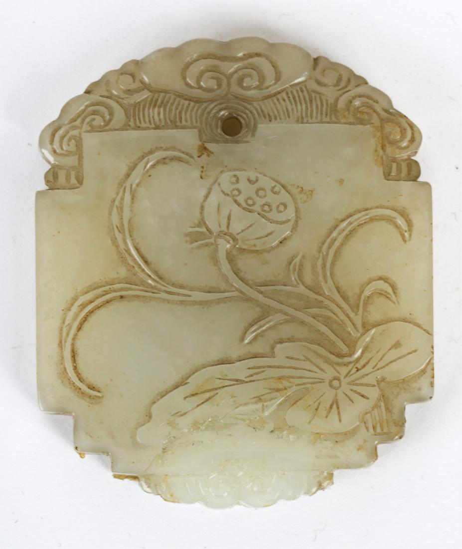 (18th / 19th c) CHINESE WHITE JADE PLAQUE SIGNED: Carved with a stylized water lily and on the opposite side with a Chinese character. 2 1/8 x 1 7/8 inches