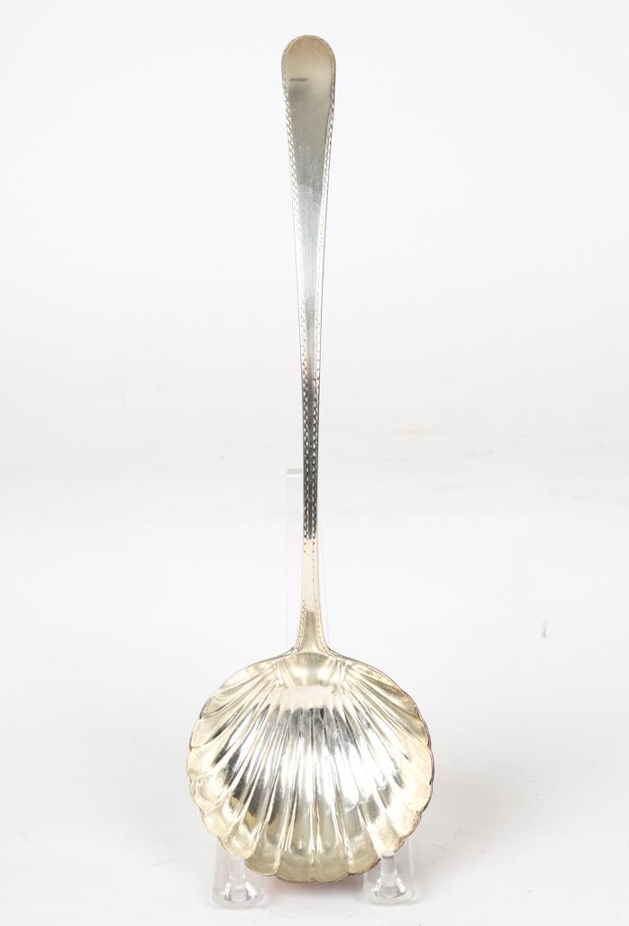 MICHAEL KEATING STERLING SILVER PUNCH LADLE: 1779 George III Dublin Ireland punch ladle with scalloped bowl and bright cut handle. 13 inches 4.7 troy ounces.
