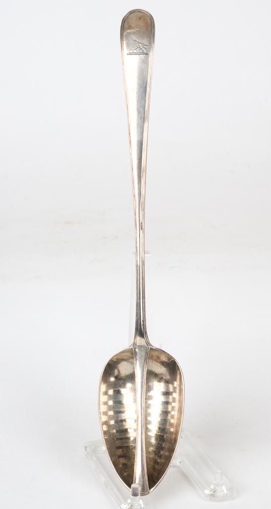 MICHAEL KEATING STERLING SILVER STRAINING SPOON: (18th c) George III Irish straining spoon engraved with a perched bird at the end of the handle. 12 1/4 inches. 4.2 troy ounces