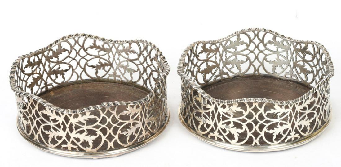 1765 JOHN LANGFORD STERLING SILVER WINE COASTERS: Undulating gadrooned rim over delicately pierced scrolls and foliates. John Langford and John Sebille hallmarked. 2 x 5 inches. .