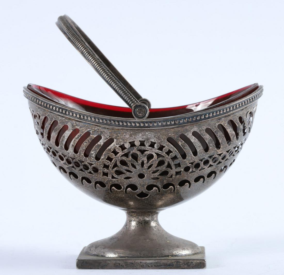 GORHAM STERLING SILVER BASKET with GLASS INSERT: Footed reticulated basket with milgrain edge and swing handle. 5.78 troy ounces.