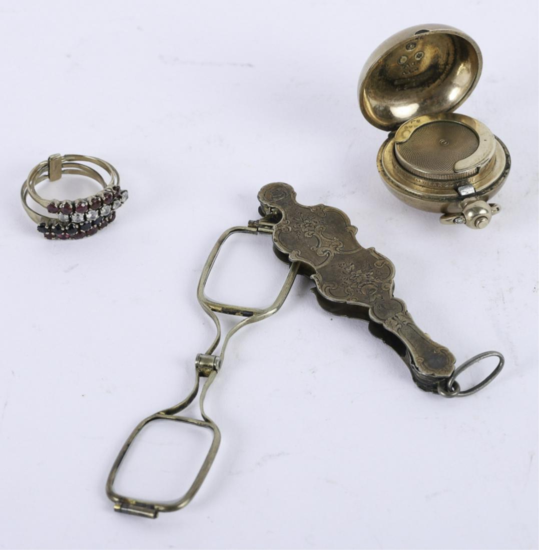 GROUPING OF ANTIQUE GOLD JEWELRY: Including: Pair of gold filled floral bright cut folding lorgnettes, (4) rose (low k) gold rings with raised line settings of semi-precious stones (size 7). Together with a gold filled change pendant.