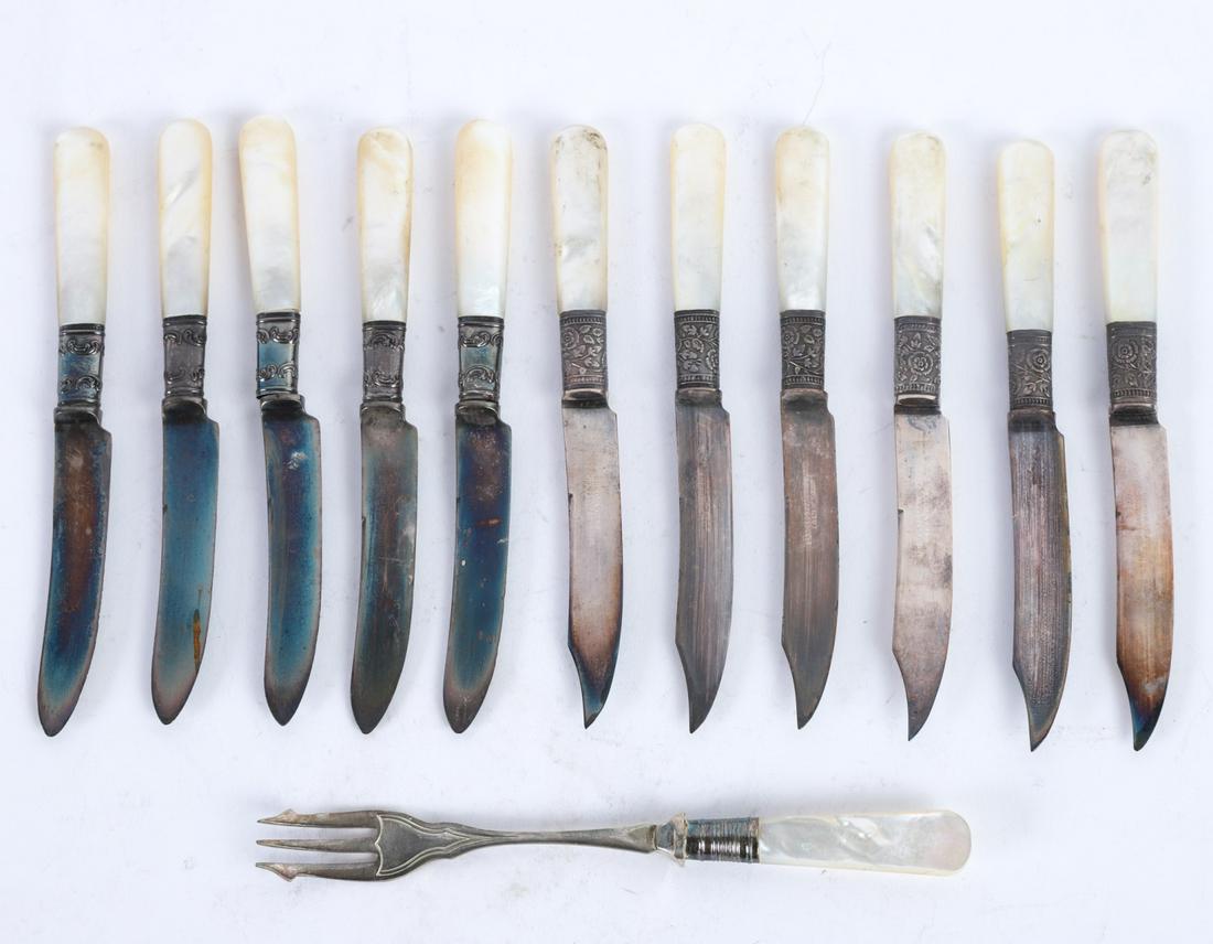 (11) LANDERS, FRARY & CLARK FRUIT KNIVES: Aetna Works, Pearl handles mounted with sterling silver ferrules. 6 inches. In (2) forms, together with a pearl handled fork and original pamphlet. 6 1/4 inches