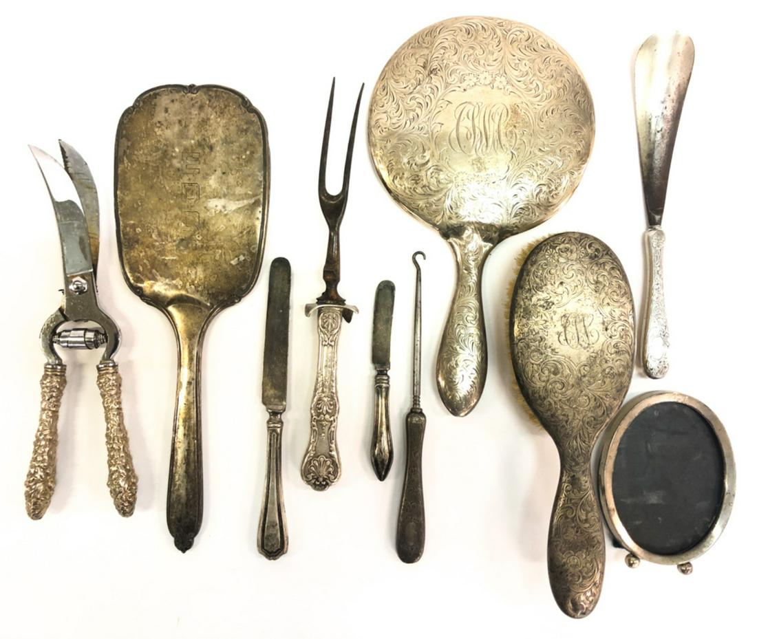 GROUPING OF (10) WEIGHTED STERLING SILVER PIECES: Including: (2) Hand mirrors, shoe horn, button hook, picture frame, poultry shears, meat fork, and a dinner and bread knife