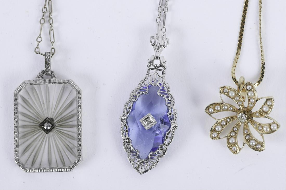 (3) GOLD NECKLACES and PENDENTS: Including: (1) 14k Floral-form pendent set with diamond and pearls (1.7dwt) with an 8 1/2 inch 18k gold chain (1.2 dwt) (1) 18k white gold 22 inch necklace 1.1 dwt (necklace only) with an engraved cry