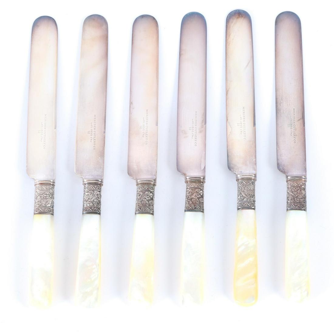 (6) MERIDEN MOTHER-OF-PEARL HANDLED KNIVES: With grape vine embossed ferrules (probably coin silver). 7 3/4 inches