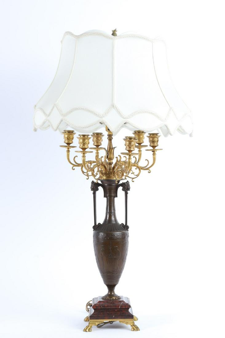 (19th c) SIGNED H.CAHIEUX and F. BARBEDIENNE: Bronze Candelabra with very fine casting after Henry Cahieux with ormolu mounts & rouge marble base all raised on lion paw feet. The amphora shaped font is decorated with classical figures cast in low
