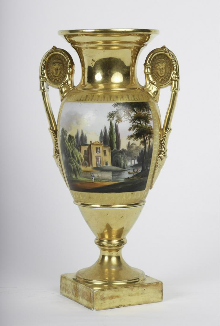 FRENCH PARIS PORCELAIN URN with ROMANTIC SCENE: Scrolled handles embossed front and back with "The Sun King". Hand painted with a manse and backdrop of poplars as a man awaits a party who is being rowed. Verso is a bouquet and wreath in gold. unmar