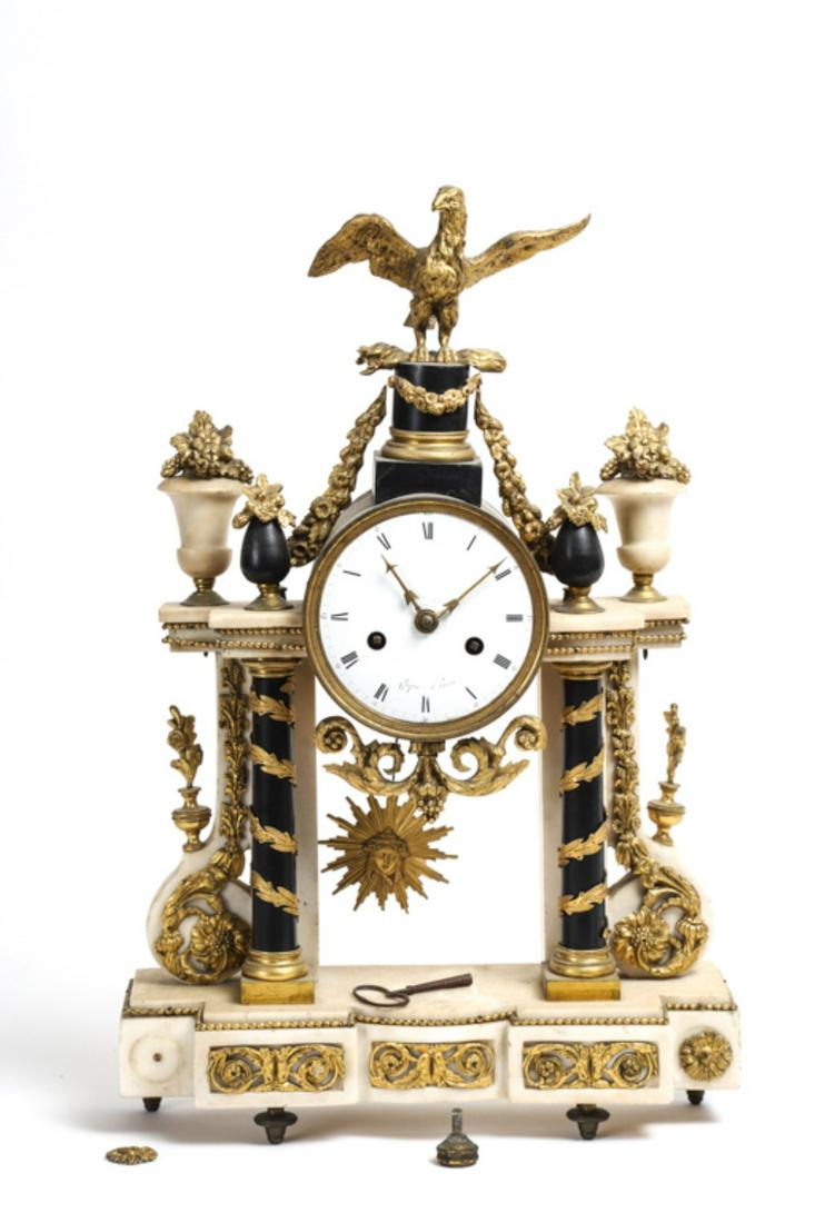 FRENCH EMPIRE NAPOLEONIC ERA PORTICO CLOCK: 4 1/2 inch dial signed Chopin a Paris, chiming movement raised on laurel wrapped onyx columns and white marble portico heavily mounted with eagle, floral swags, bouquets, scrolls and friezes. 21 inche