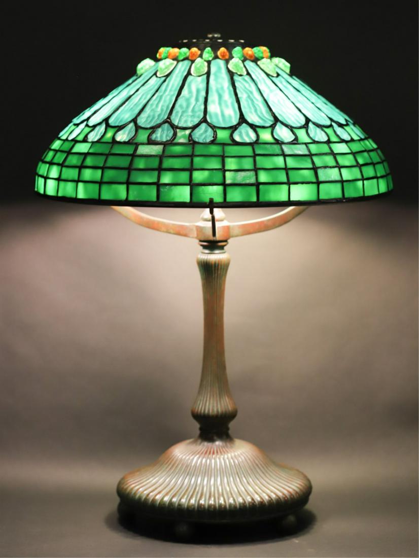 RARE TIFFANY STUDIOS NEW YORK BRONZE TABLE LAMP: (3) Socket table lamp raised on ball feet. Stamped Tiffany Studios New York #3648 under base and on lower rim of shade. 19 inches