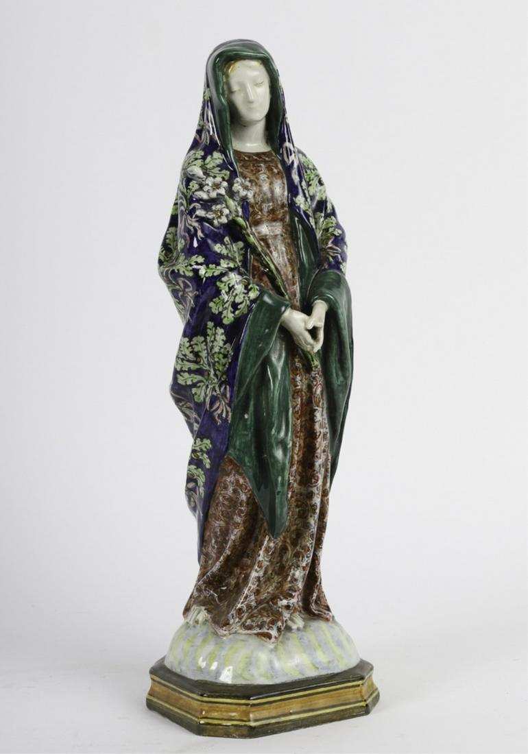 ANGELO MINGHETTI ITALIAN FAIENCE STATUETTE of MARY: Beautifully glazed, depicting holding a bouquet of lilies. signed AM in cipher and Balogna Italy. 19 inches.