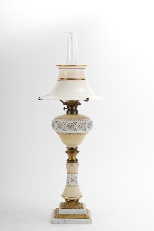 AESTHETIC MOVEMENT KEROSENE TABLE LAMP: Bell form glass shade with 10 inch fitter, hand painted glass font and pedestal with gilt bronze collar and gilt ormolu mounted marble base.
