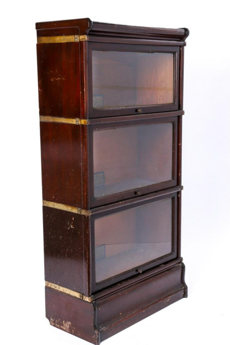 GLOBE-WERNCIKE MAHOGANY (4) TIER BOOKCASE: 52 x 25 x 12 inches. Shelves measure 10 1/4, 12 1/4 and 12 1/4 inches