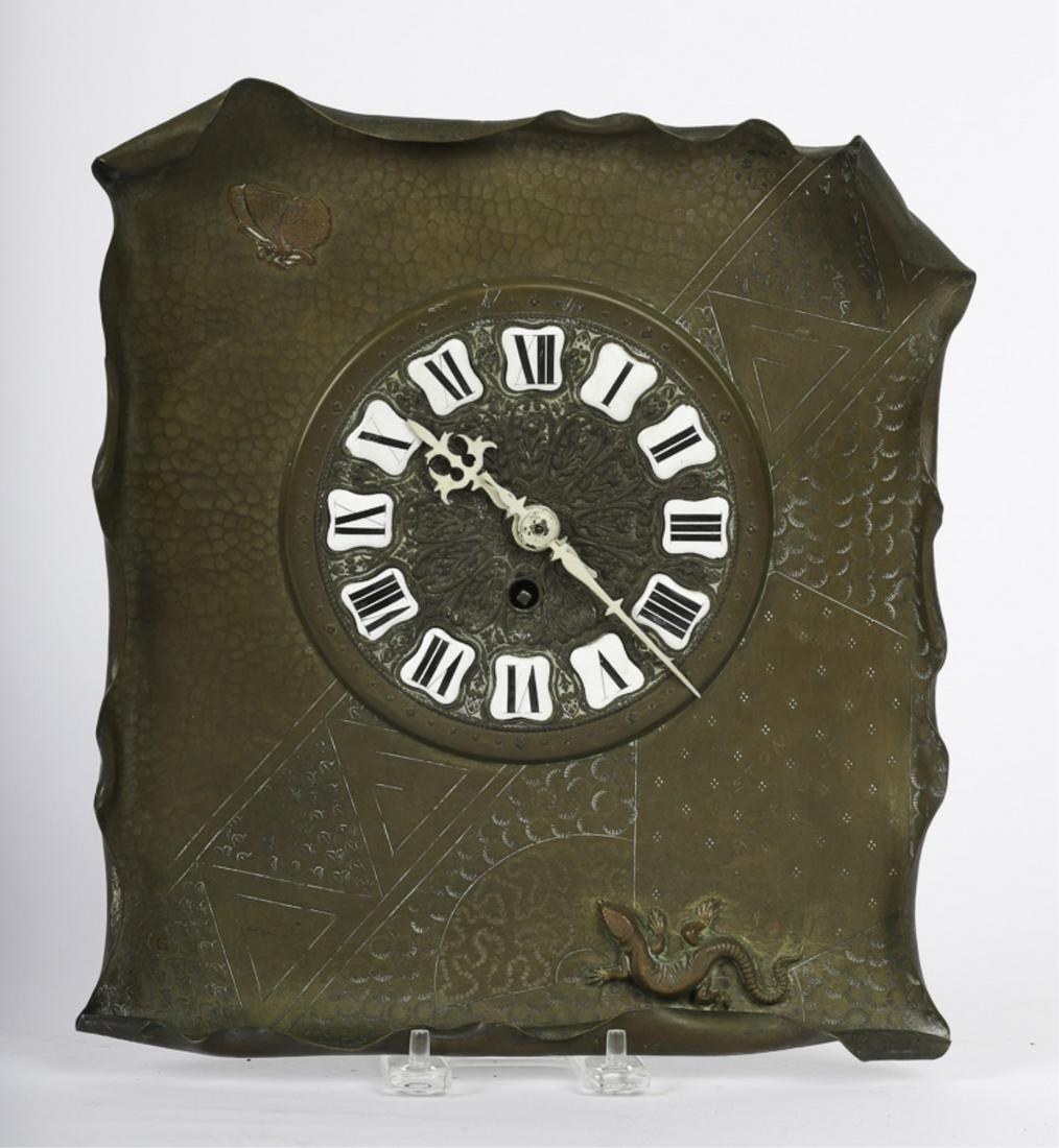 ARTS AND CRAFTS BRONZE WALL CLOCK: W/ copper butterfly and lizard. Engraved on front "Boston Canoe Club". Nice engraved design and nice detail to butterfly and lizard. Porcelain Roman numeral numbers. Brass works marked w/ number. Cloc