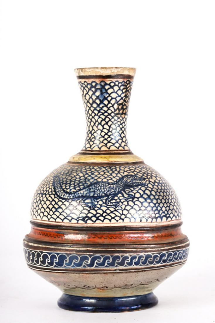 ANTIQUE PERSIAN CERAMIC VASE: Decorated with a crocodile on a diaper ground. unsigned. 8 1/5 inches