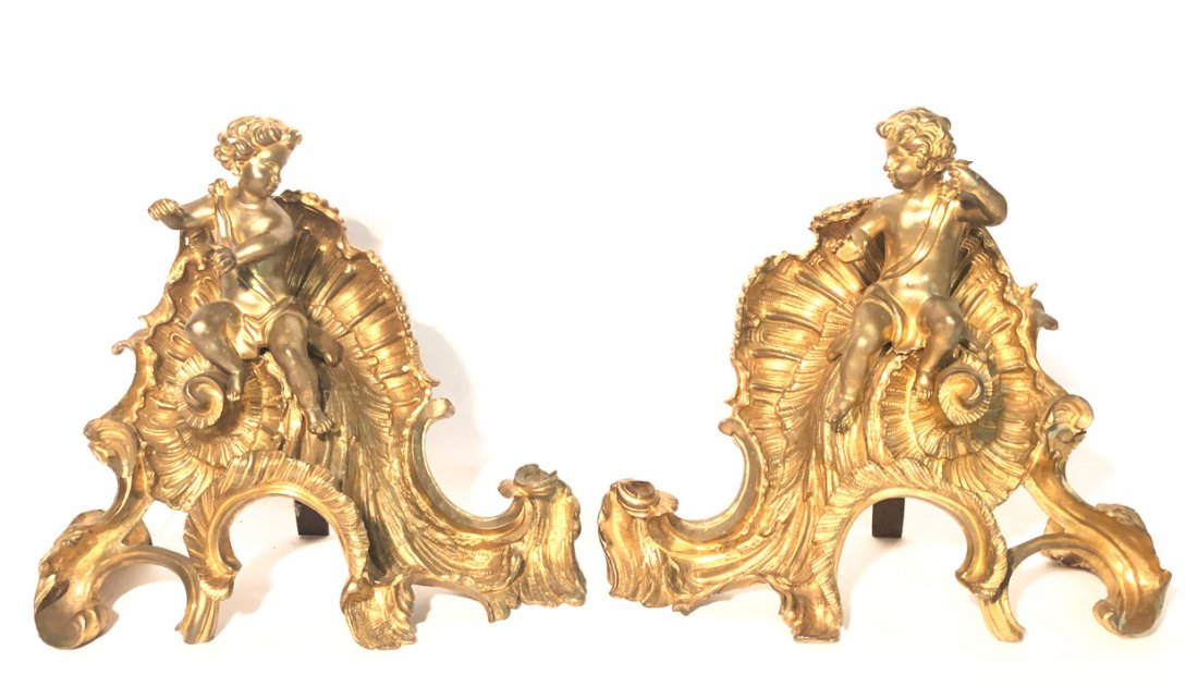 PAIR of BRONZE CHINETS in the ROCOCO STYLE: Cherubs toast while sitting on scrolled shells. 9 1/4 inches