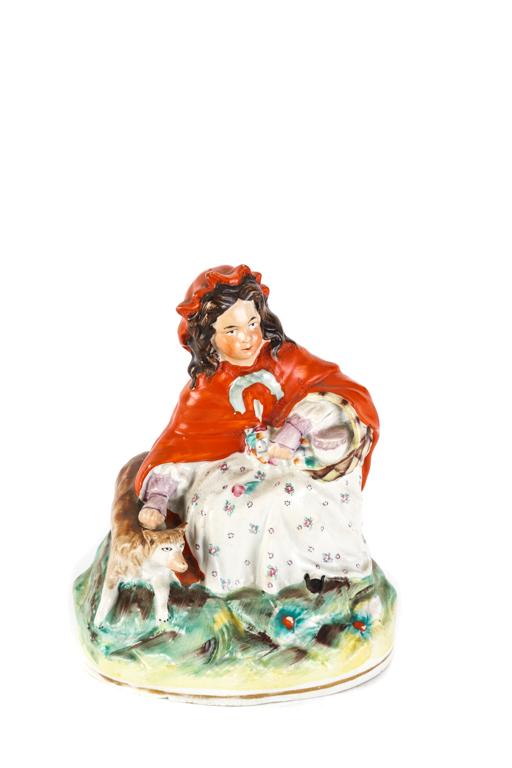 STAFFORDSHIRE FIGURE GROUP LITTLE RED RIDING HOOD: Crouching woman with basket, flowers and dog. unmarked. 7 1/2 inches.