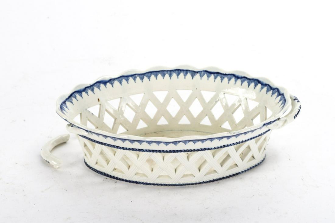 ENGLISH FEATHER EDGE OVAL CREAMWARE BASKET: Embossed "Herculaneum" under base 2 1/2 x 8 1/2 x 5 1/4 inches.