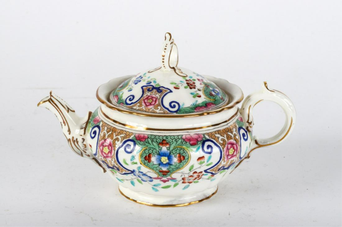 MINTONS PORCELAIN TEAPOT: Hand painted with stylized floral motif. signed. 4 1/2 inches
