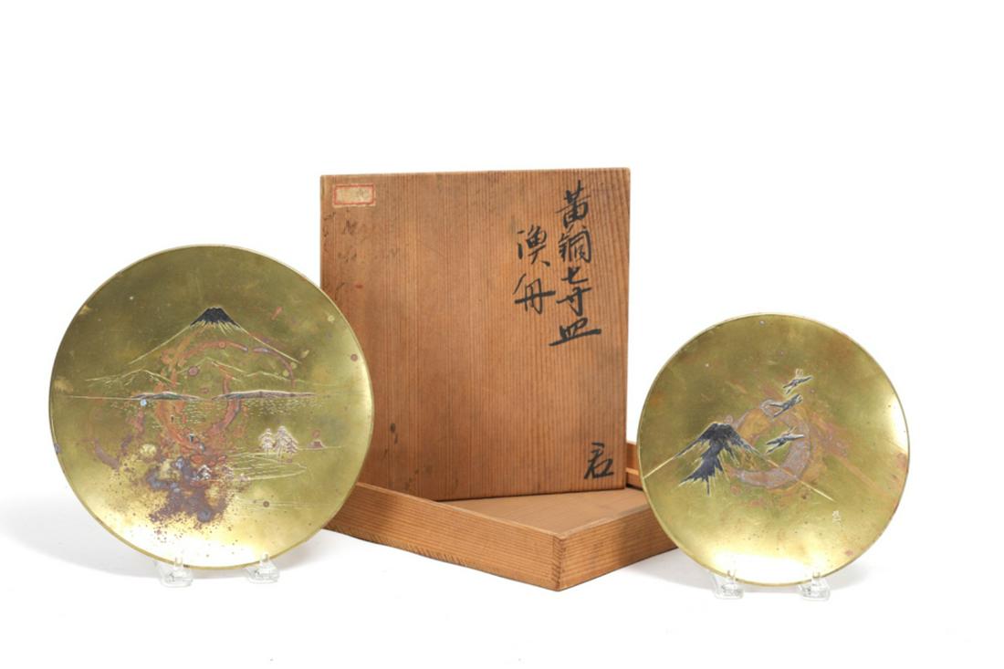 2 SIGNED MEIJI PERIOD MIXED METAL JAPANESE PLATES: Each depicting landscapes of Mt. Fuji. signed front and back. 7 and 8 1/2 inches.