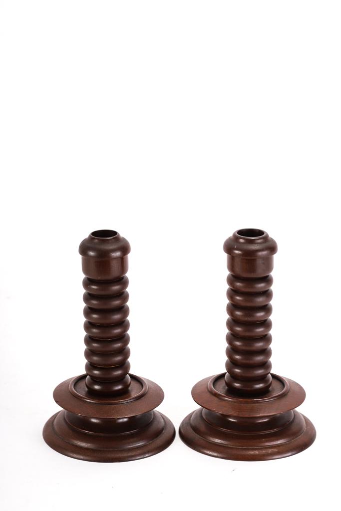 PAIR CANDLE STICKS TURNED FROM EXOTIC WOOD: Unmarked. 7 1/4 inches.