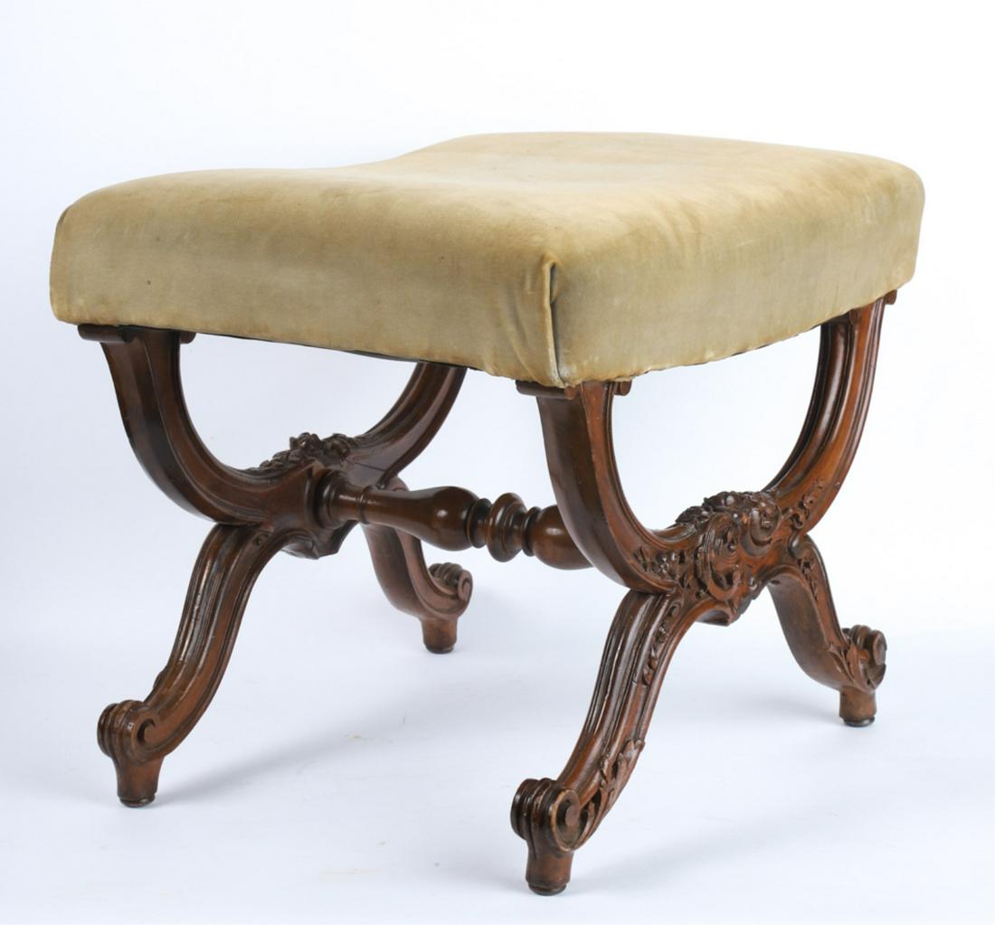 LOUIS XV STYLE UPOLSTERED STOOL: Molded legs carved with rococo scrolls and volutes and supported by a turned cross stretcher. 16 x 21 x 16 inches