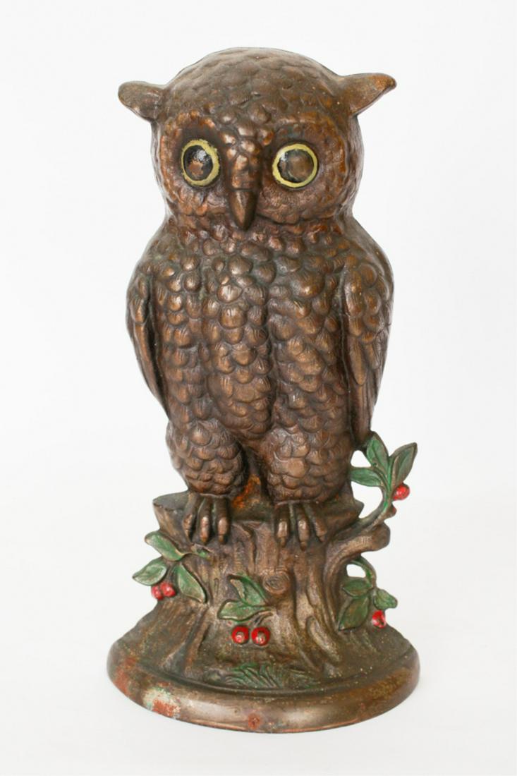 ATTRIBUTED to HUBLEY CAST IRON OWL DOORSTOP: Early 20th century, bronzed and polychrome decorated, owl perched on a stump with foliate, 10 x 4.5 inches