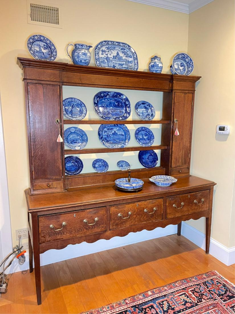 18TH CENTURY TWO PART ENGLISH OAK DRESSER: In two parts, the molded cornice top above three plate rail shelves flanked by narrow cabinets above drawers, the lower section has a rectangular top above three drawers over a cut-out apron, the whol