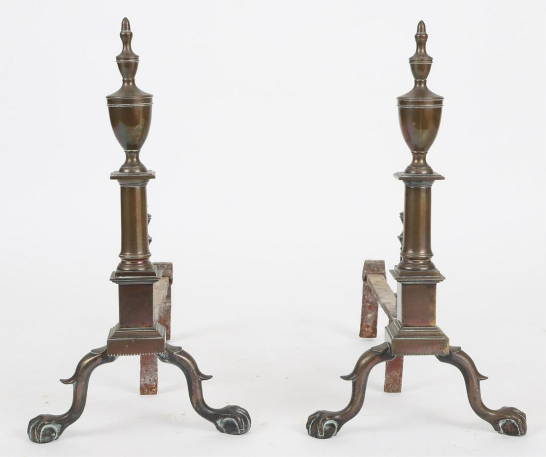PAIR OF FEDERAL DOUBLE URN ANDIRONS: Acorn finial tops above a small urn over graduated urn, round to square shaft, raised on cabriole spurred legs ending in ball and claw feet, retains log stops, 21 x 11.5 x 21 inches