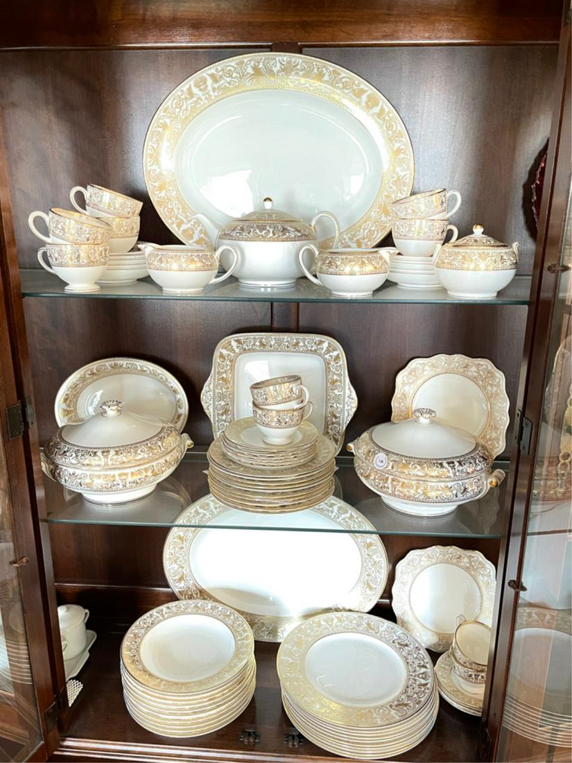 WEDGWOOD FLORENTINE CHINA SERVICE FOR TEN: Gilt decorated borders, consisting of 10 dinner plates, 10.5 inches diameter, 12 dessert plates, 8 inches diameter,10 salad bowls, 9 inches diameter, 10 cup and saucer sets, two covered vegetables, tw