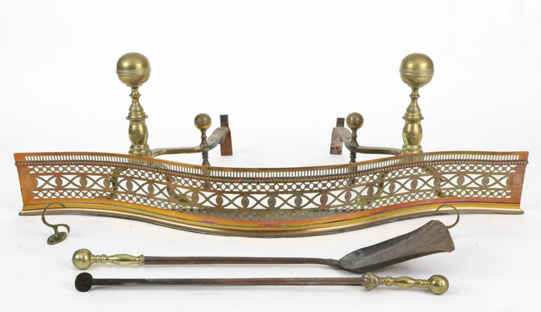 BRASS FIREPLACE SUITE: Consisting of a pair of Empire cannonball andirons with cabriole legs, matching tools and a serpentine pierced fire fender, comes with jam hooks, andirons, 16 x 11 x 19 inches, tools, 29 inches high, 