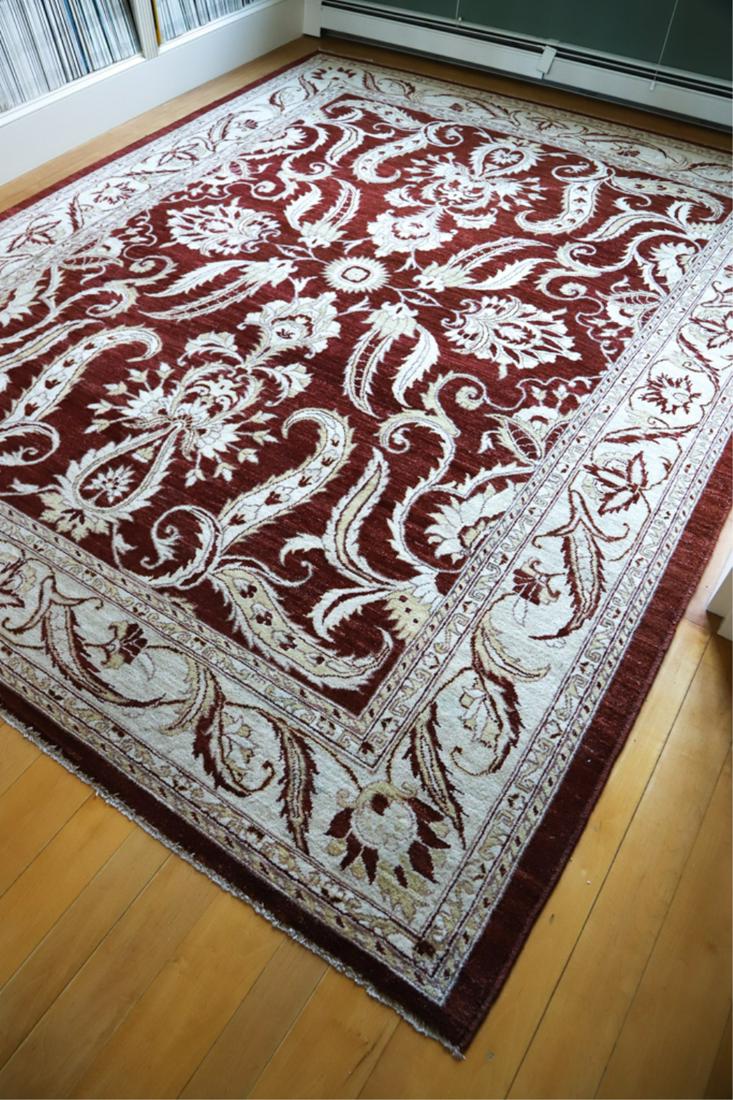 PAKISTAN MODERN ROOM SIZE HANDMADE CARPET: Burgundy field with ivory floral motifs and ivory borders. 10 feet 2 inches x 8 feet 2 inches