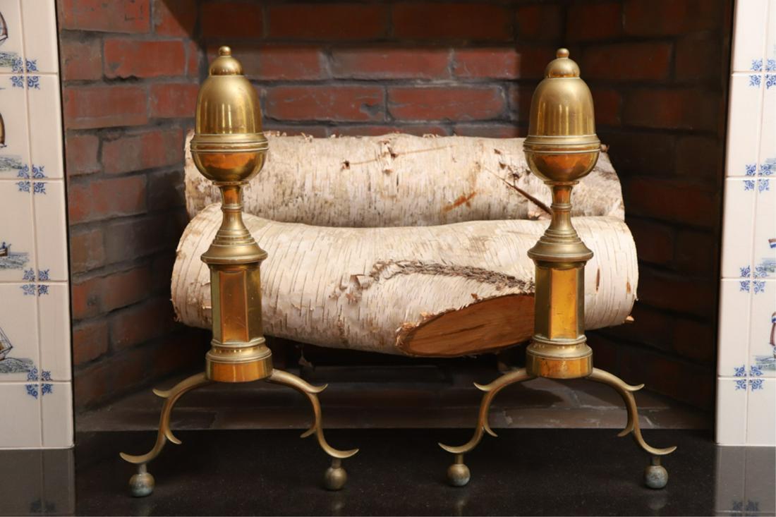 PAIR OF BRASS 19TH C ACORN TOP ANDIRONS: Elongated tops above a faceted shaft raised on spurred cabriole legs ending in ball feet, 20.5 x 11 x 25 inches