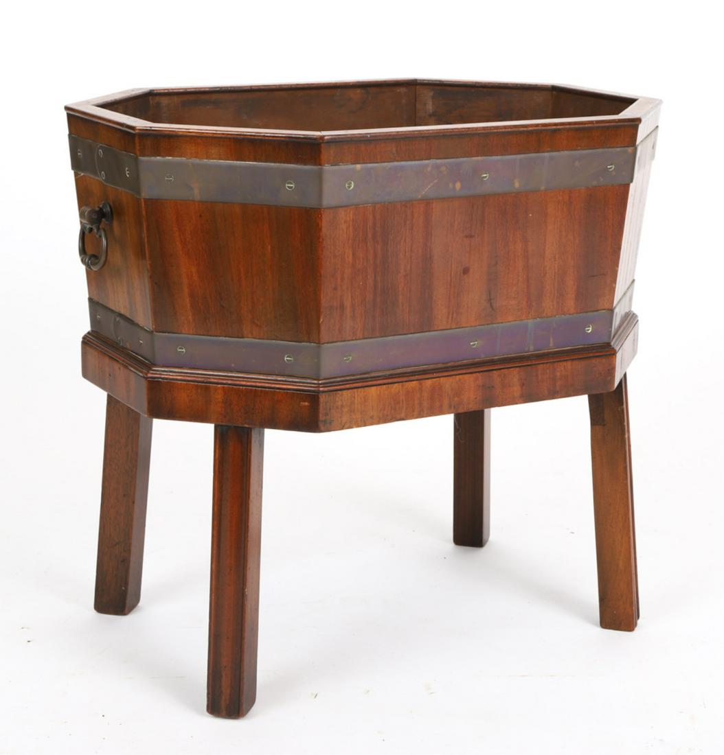 19th CENTURY MAHOGANY CELLARETTE/PLANTER: Polygon form, slightly canted, with brass handles and strapping, raised on molded Marlborough legs, with metal plant liner, 20 x 21 15 inches