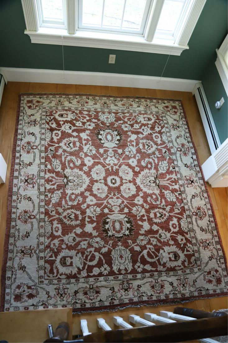 HANDMADE MODERN PAKISTANI AREA CARPET: With repeating floral center. 6 feet 7 inches x 7 feet 5 inches